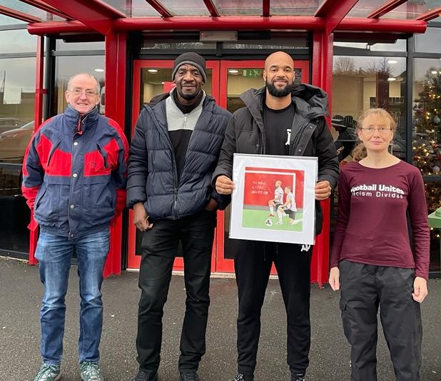 David McGoldrick presentation - David McGoldrick being presented with 'Shoulder to Shoulder' by John Wilson, Ruth and Simon.