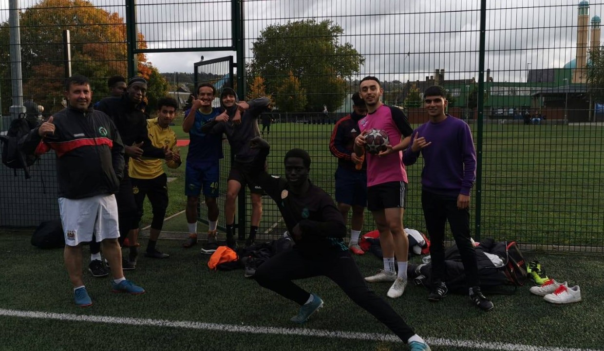 Mohamed volunteer coach - Mohamed on the left with a group.