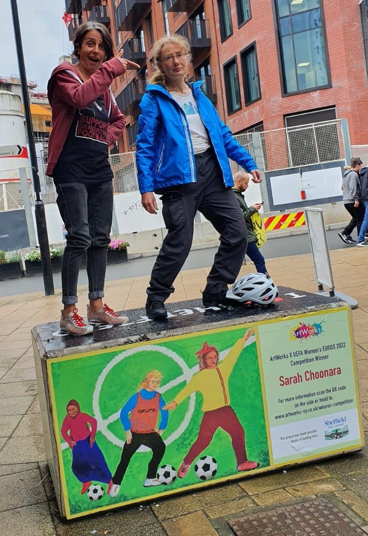 Sarah and Ruth on Sarah's artwork - Sarah Choonara and Ruth Johnson on Sarah's artwork. 30/7/22, Sheffield city centre.